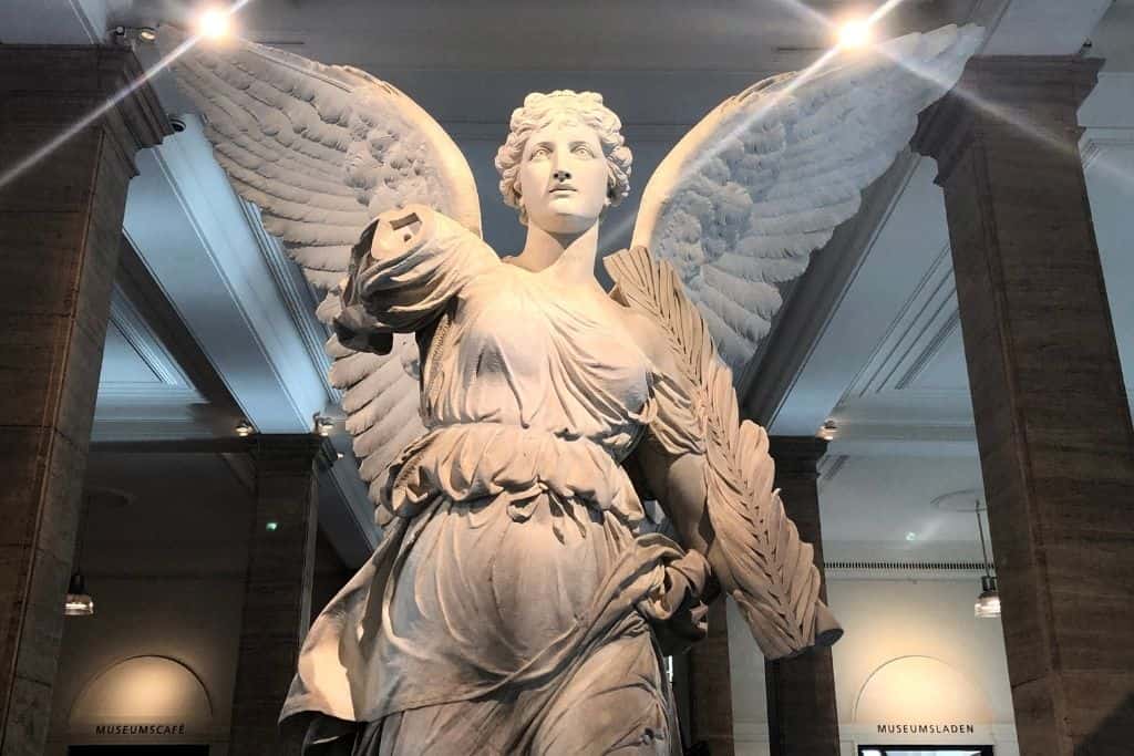A marble statue of a winged female figure in the lobby of the German Historical Museum in Berlin.