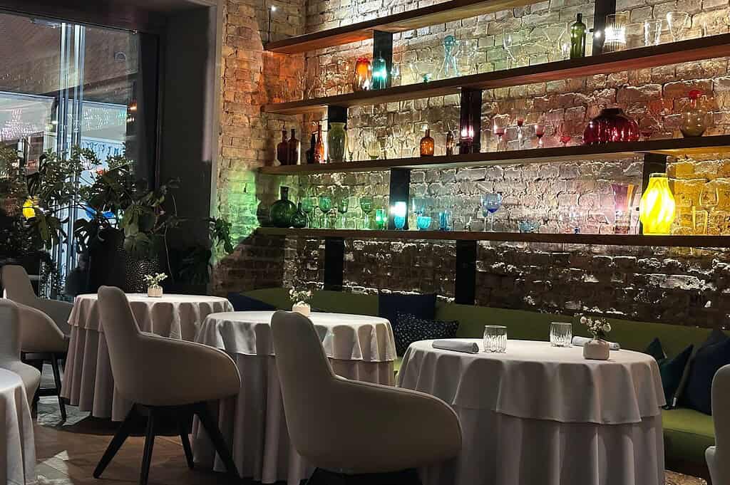 Photo gallery of Babel Budapest, beginning with the restaurant’s intimate brick-walled dining room and followed by plated meat and fish courses that reflect its refined, contemporary approach to Hungarian cuisine.
