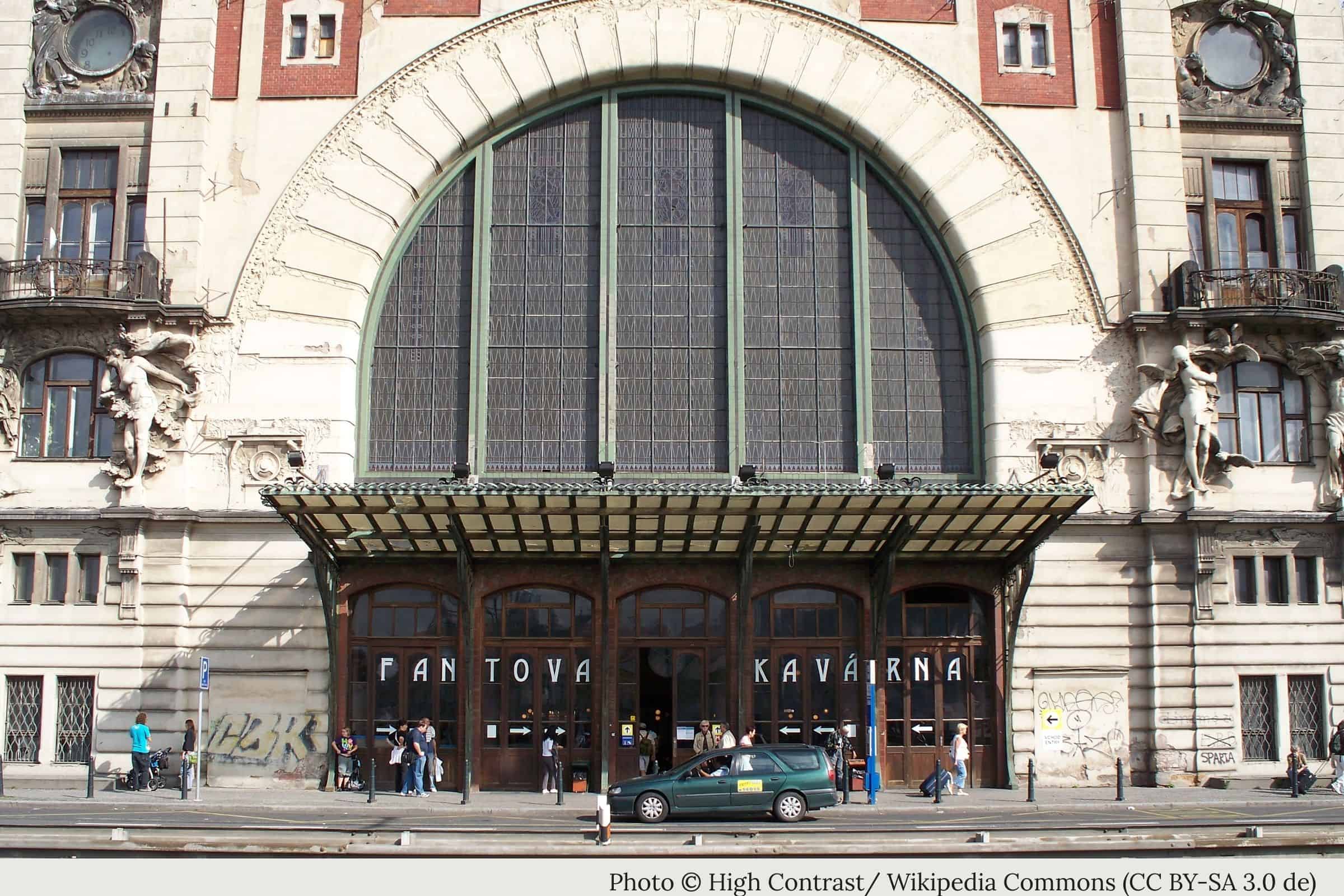 Fantova Kavárna entrance at Prague Main Railway Station with arched Art Nouveau façade