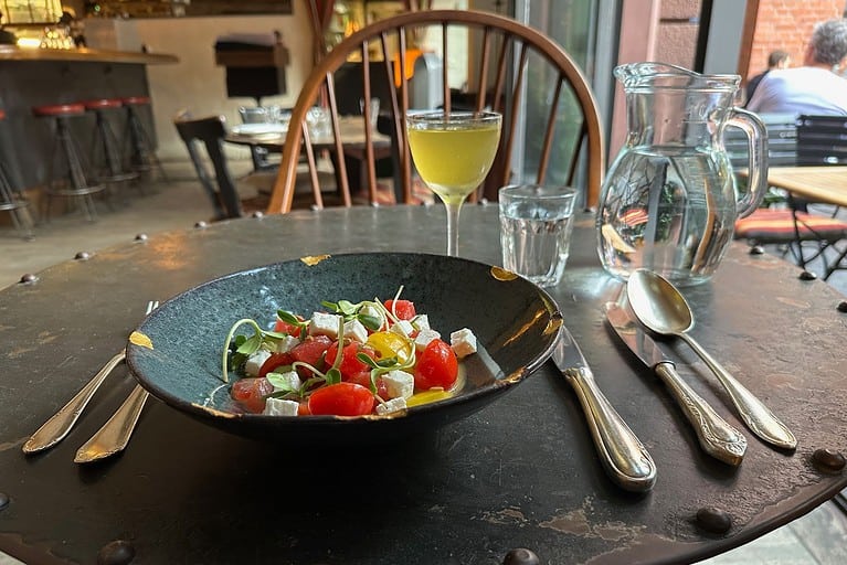 Seasonal watermelon and tomato salad at Katz Orange Berlin with fresh herbs and light vinaigrette