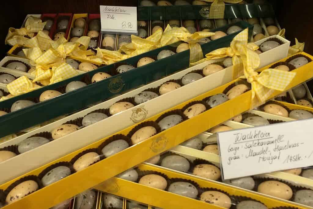 Boxed Easter chocolate eggs tied with yellow ribbons at Xocolat in the Freyung, Vienna