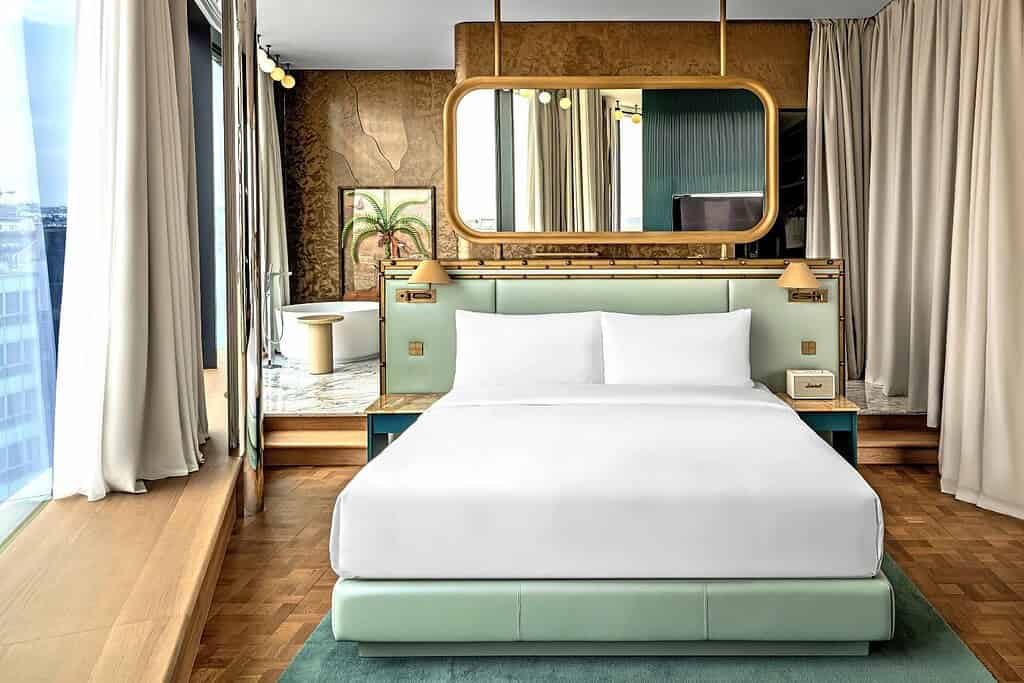 W Prague luxury hotel carousel featuring a designer suite, Minus One cocktail bar, and the restored Art Nouveau welcome area on Wenceslas Square in Prague