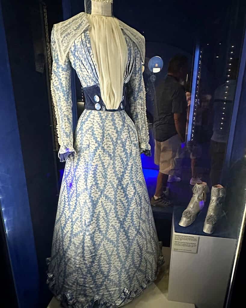Azure blue and white patterned dress worn by Empress Elisabeth, displayed in the Sisi Museum in Vienna, with matching boots