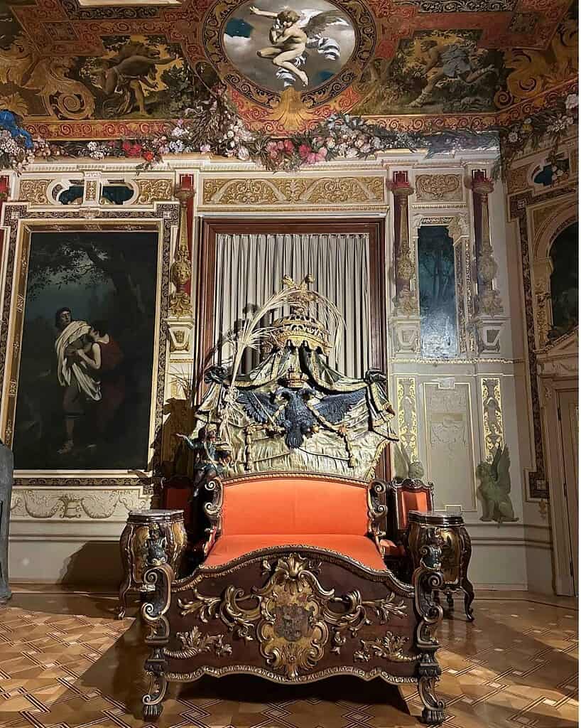 Empress Elisabeth Sisi bedroom Hermesvilla outside of Vienna with ornate bed and gilded interiors