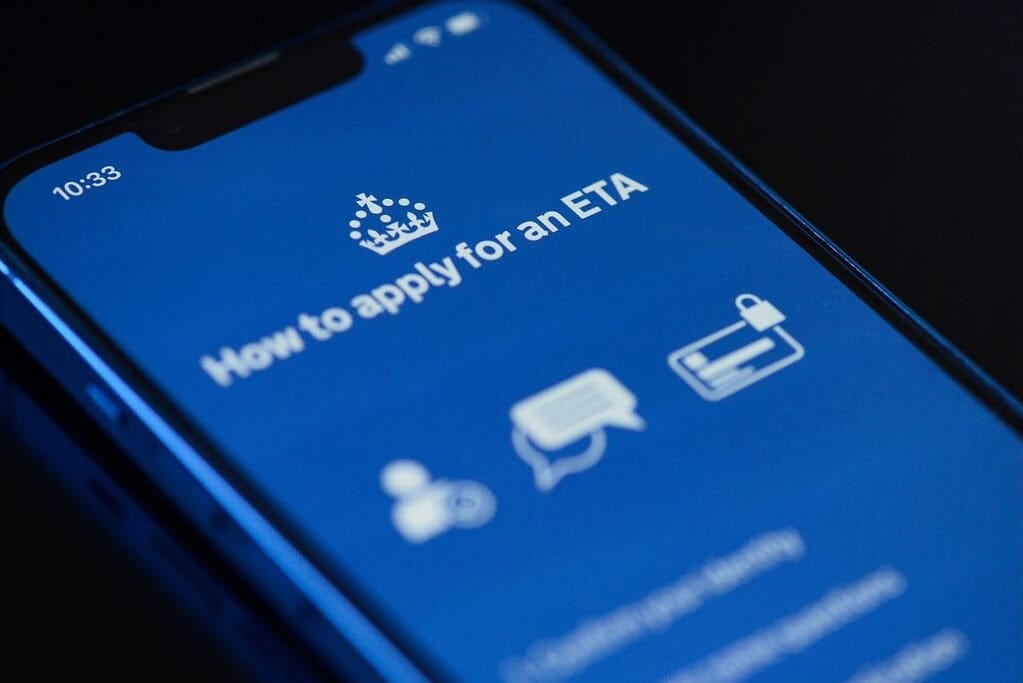 Smartphone displaying instructions for applying online for a UK Electronic Travel Authorisation