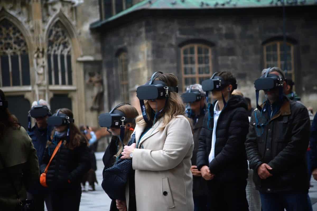 Group of visitors wearing virtual reality headsets at Stephansplatz in Vienna’s Old Town