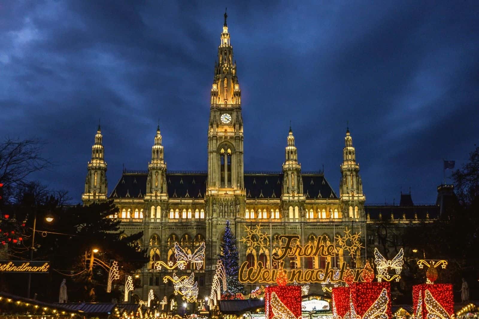 Vienna Christmas market at the Rathaus illuminated with Christmas lights and adorned with decorations