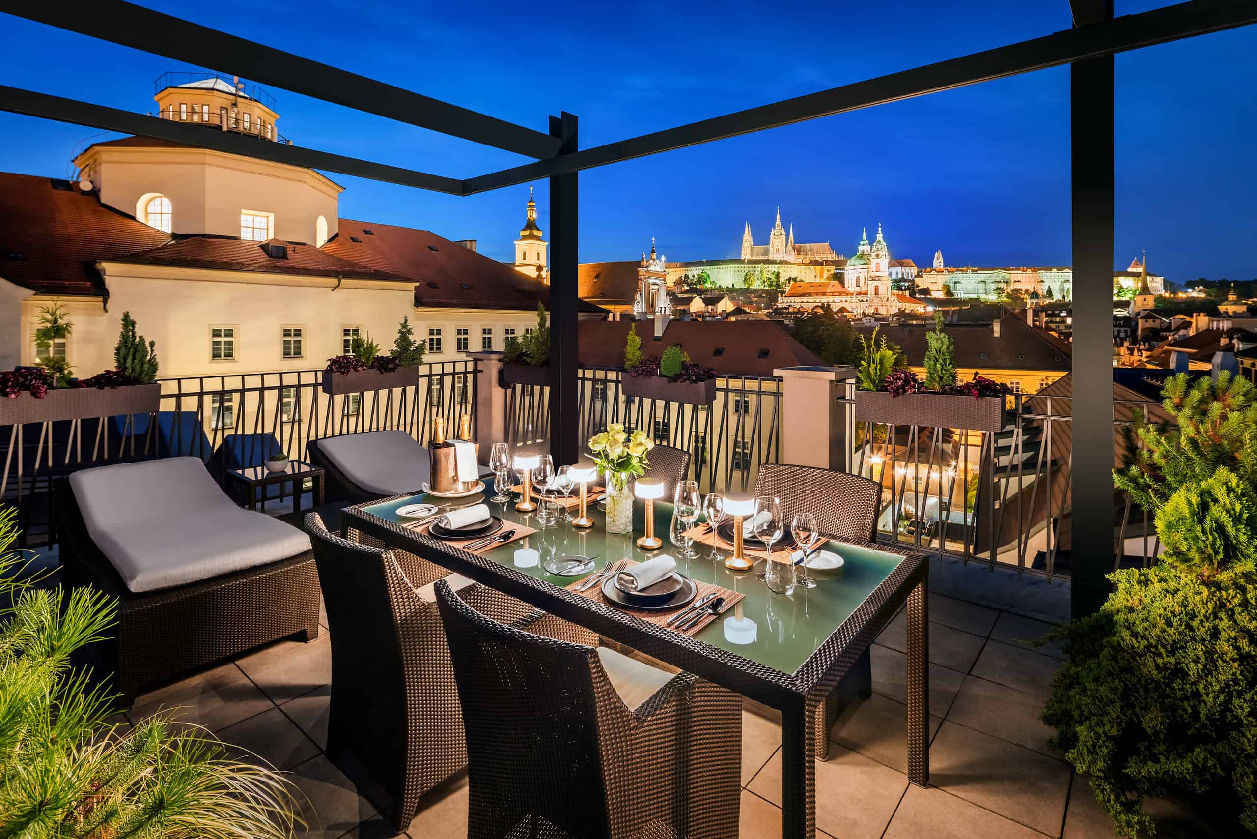Nighttime view across Malá Strana toward Prague Castle and St. Vitus Cathedral from a terrace at Mandarin Oriental, Prague